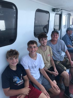 Aiden Moffat et al. sitting on a bus