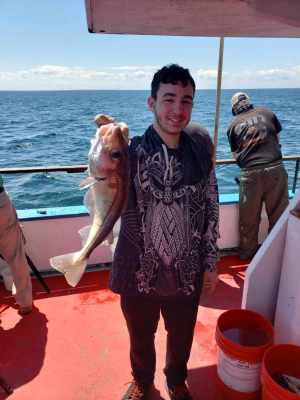 a couple of people that are standing in the water
