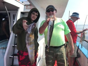 a person holding a fish