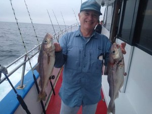 a man holding a fish