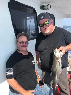 a person holding a fish