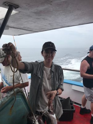 a group of people standing on a boat