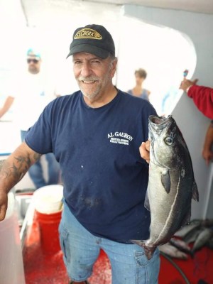 a man holding a fish