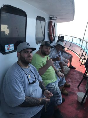 a group of people standing around a bus