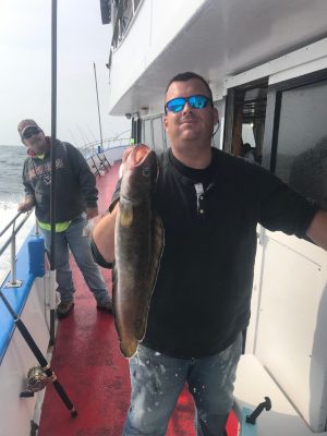 a person holding a fish