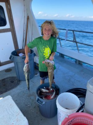 a person standing in front of a boat