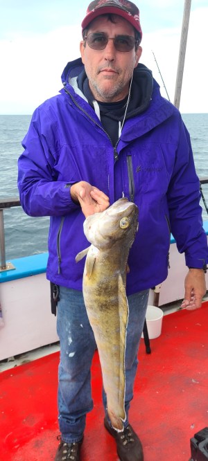 a man holding a fish