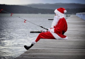 a person flying a kite in a boat on a body of water