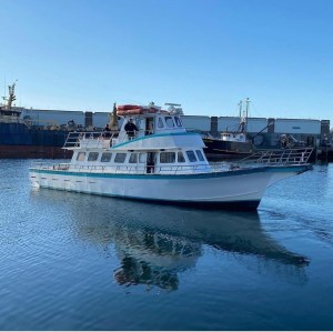 a boat is docked next to a body of water