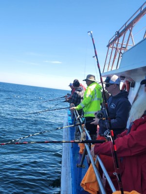 a group of people on a boat in the water