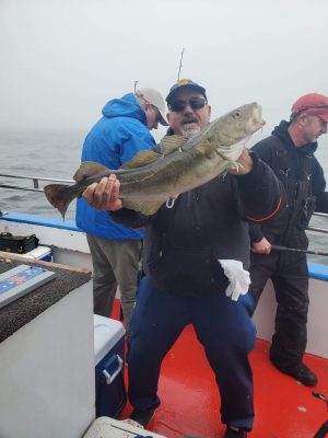 a person holding a fish