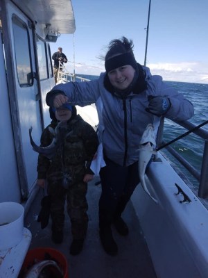 a couple of people that are standing in the snow