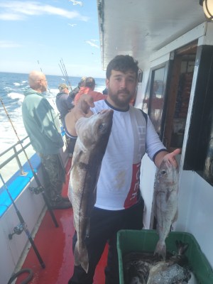 a man holding a fish