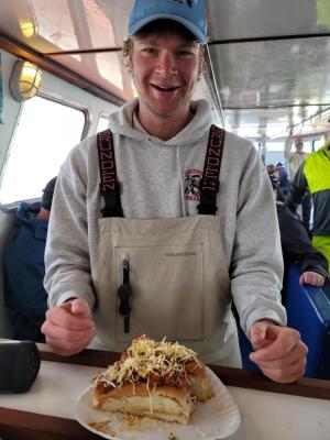 a person standing in front of a cake