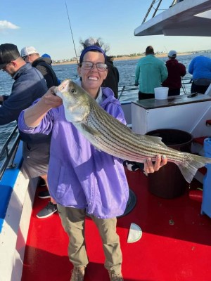 a person holding a fish