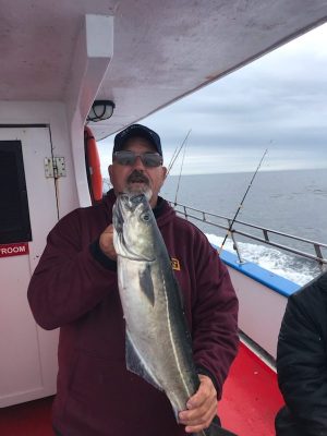 a man holding a fish