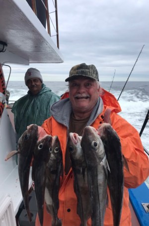 a man holding a fish