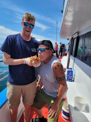 a man holding a hot dog