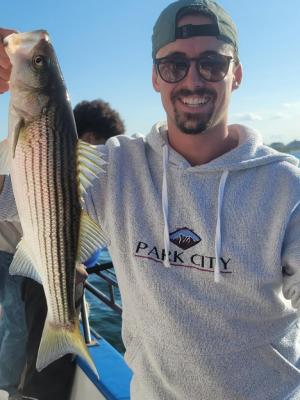 a man holding a fish