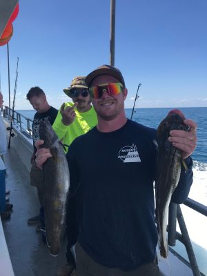 a man holding a fish