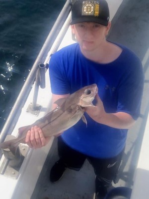 a person holding a fish