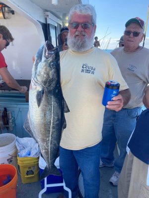 a man holding a fish