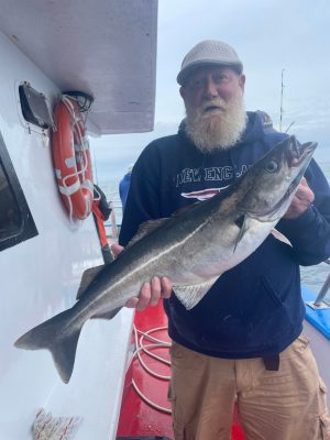 a man holding a fish