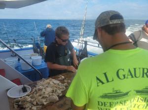 a group of people on a boat in the water