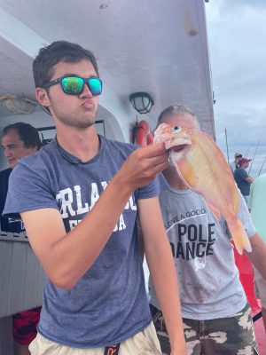 a man holding a fish