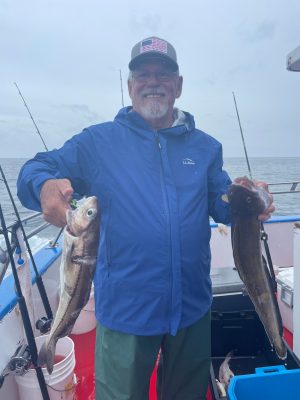 a man holding a fish