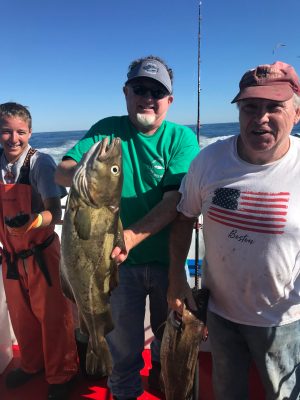 a man holding a fish