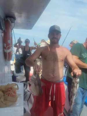 a man holding a fish