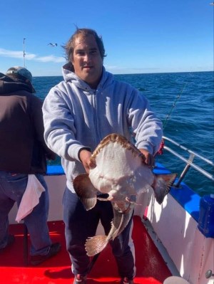 a man standing on a boat in the water