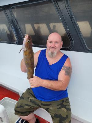 a man holding a fish