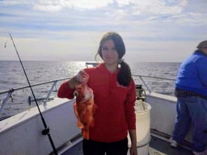 a person standing next to a body of water