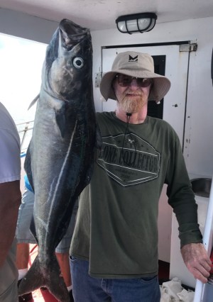 a man holding a fish